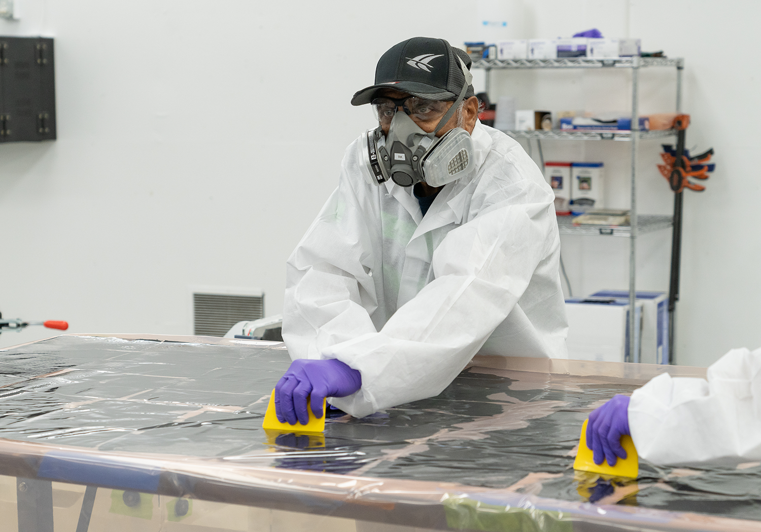 Employee using wet lay composites